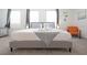 Inviting bedroom with a queen-size bed adorned with decorative towels and a soft, gray blanket at 4149 Paragraph Dr, Kissimmee, FL 34746