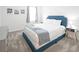 Cozy bedroom featuring a plush, cushioned headboard and neutral-toned decor at 4149 Paragraph Dr, Kissimmee, FL 34746