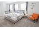 Comfortable bedroom featuring a king bed, neutral tones, and modern décor for relaxation and style at 4149 Paragraph Dr, Kissimmee, FL 34746