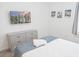 Bright bedroom featuring modern art and a neatly made bed with a flat screen TV at 4149 Paragraph Dr, Kissimmee, FL 34746