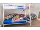bedroom features a bunk bed with colorful Paw Patrol themed comforter and sheets at 4149 Paragraph Dr, Kissimmee, FL 34746