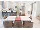 Open-concept dining area with modern table and chairs, seamlessly connected to the kitchen at 4149 Paragraph Dr, Kissimmee, FL 34746