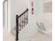 Cozy hallway with staircase and a decorative swing chair, offering a blend of style and comfort at 4149 Paragraph Dr, Kissimmee, FL 34746