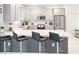 Modern kitchen featuring stainless steel appliances, a breakfast bar, and ample cabinet space at 4149 Paragraph Dr, Kissimmee, FL 34746