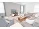 Comfortable living room featuring modern decor, plush seating, and plenty of space for relaxation at 4149 Paragraph Dr, Kissimmee, FL 34746
