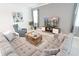 Relaxing living room features two sofas, contemporary decor, and a large TV for comfortable lounging at 4149 Paragraph Dr, Kissimmee, FL 34746