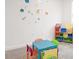 Playroom with colorful decor and toy storage at 4149 Paragraph Dr, Kissimmee, FL 34746