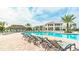 Resort-style pool area with lounge chairs, tiki hut, and covered pavilion, perfect for relaxation and community gatherings at 4149 Paragraph Dr, Kissimmee, FL 34746