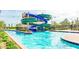 Community waterpark with slides, lazy river, and lush landscaping provides endless fun for residents of all ages at 4149 Paragraph Dr, Kissimmee, FL 34746