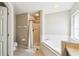 Bathroom featuring a separate shower and soaking tub at 440 Langham Dr, Davenport, FL 33897