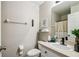 Bathroom featuring a white vanity with a modern faucet and stylish decor accents and a neutral shower curtain at 440 Langham Dr, Davenport, FL 33897