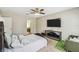 Bedroom featuring neutral walls, a ceiling fan, plush carpet, and access to the en suite bathroom at 440 Langham Dr, Davenport, FL 33897