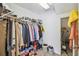 Walk-in closet with ample storage space, shelving, clothing racks, and organized shoe boxes at 440 Langham Dr, Davenport, FL 33897