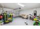 Spacious garage that has a table and chairs with a garage door at 440 Langham Dr, Davenport, FL 33897