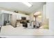 Bright kitchen with modern appliances and a view of the dining area at 440 Langham Dr, Davenport, FL 33897