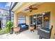 Covered patio with seating area that includes ceiling fan at 440 Langham Dr, Davenport, FL 33897