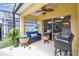Covered patio with seating area that includes ceiling fan at 440 Langham Dr, Davenport, FL 33897