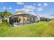 Aerial view of beautiful enclosed in-ground pool for Gathering enjoyment at 440 Langham Dr, Davenport, FL 33897