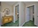 Hallway features a charming cabinet and doorway views into other rooms at 6589 Banyan Dr, Indian Lake Estates, FL 33855