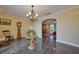 Elegant living room featuring a decorative chandelier, tile floors, and adjacent sitting area at 6589 Banyan Dr, Indian Lake Estates, FL 33855