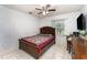 Cozy bedroom with a bed, a window for natural light, and tiled floors, perfect for a peaceful retreat at 820 Lamp Post Ln, Lakeland, FL 33809