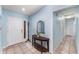 Inviting entryway with neutral tile flooring and a decorative table at 820 Lamp Post Ln, Lakeland, FL 33809