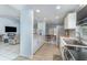 Bright kitchen with stainless steel appliances, white cabinets, and modern countertops at 820 Lamp Post Ln, Lakeland, FL 33809