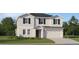 Charming two-story home with a two-car garage, neutral siding, black shutters, and a well-manicured lawn at 4742 Bold Peacock Bnd, Bartow, FL 33830