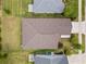 Overhead aerial view of the roof, backyard, and well-maintained landscaping at 5008 Ne 125Th Loop, Oxford, FL 34484