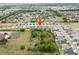 Scenic aerial shot of a residential neighborhood, highlighting the property's location at 5008 Ne 125Th Loop, Oxford, FL 34484