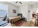 Bedroom featuring a cozy bed, desk, and window showcasing the decor and layout at 5008 Ne 125Th Loop, Oxford, FL 34484