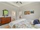 A comfortable bedroom with a view of the ensuite bathroom and walk-in closet at 5008 Ne 125Th Loop, Oxford, FL 34484