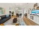 Open-concept layout showcasing the living room, dining area, and kitchen, perfect for modern living and entertaining at 5008 Ne 125Th Loop, Oxford, FL 34484