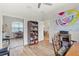 The office has a large window, built-in storage, and elegant laminate flooring at 5008 Ne 125Th Loop, Oxford, FL 34484