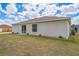 Spacious backyard with lush green lawn offering a serene outdoor space at 1628 Saddlehorn Dr, Lakeland, FL 33810