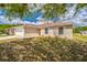 Single-story home with a two-car garage and a neatly landscaped front yard at 1628 Saddlehorn Dr, Lakeland, FL 33810