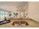A double kitchen sink featuring stone countertops and bright, open access to the dining area and living room at 1628 Saddlehorn Dr, Lakeland, FL 33810