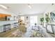 Bright living room with modern decor, wood floors, and an open layout to the kitchen at 1628 Saddlehorn Dr, Lakeland, FL 33810