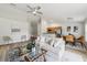 Cozy living room featuring modern decor, wood floors, and an open design to the kitchen at 1628 Saddlehorn Dr, Lakeland, FL 33810