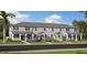Charming townhome with well-maintained landscaping, covered entrances, and neutral-colored exterior at 1925 Fulfillment Dr, Kissimmee, FL 34744