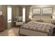 Comfortable main bedroom featuring soft lighting, neutral tones, stylish decor, and plush bedding at 1925 Fulfillment Dr, Kissimmee, FL 34744