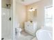 Bright bathroom featuring a walk-in shower, toilet, and vanity with gray tile flooring at 4844 Creek Meadow Trl, Lakeland, FL 33810
