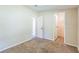 A door from this bedroom accesses a walk-in closet with overhead storage and a view to another room at 4844 Creek Meadow Trl, Lakeland, FL 33810
