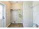 Utility room featuring washer and dryer hookups, storage shelves, and a door to the outside at 4844 Creek Meadow Trl, Lakeland, FL 33810