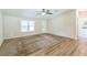 Inviting living room featuring carpet, wood floors, and natural light from the windows at 4844 Creek Meadow Trl, Lakeland, FL 33810