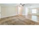 Bright and airy living room with wood-look flooring and neutral wall paint at 4844 Creek Meadow Trl, Lakeland, FL 33810