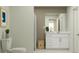 Neutral bathroom with tiled shower and vanity, and features a decorative plant, giving a cozy feel at 947 Hour Glass Rd, Lakeland, FL 33801