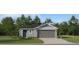 Charming single-story home with gray siding, a two-car garage, and a well-maintained lawn at 947 Hour Glass Rd, Lakeland, FL 33801
