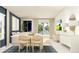 Bright and airy living room with open floor plan, dining, and views of the yard at 947 Hour Glass Rd, Lakeland, FL 33801