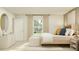 Bright main bedroom with plenty of natural light, a comfortable bed, and neutral decor at 947 Hour Glass Rd, Lakeland, FL 33801